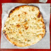 Garlic Naan · Teardrop shaped white bread with a touch of garlic.