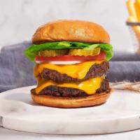 Double Identité Burger  · Two American beef patties topped with melted cheddar cheese, lettuce, tomato, onion, and pic...
