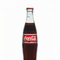 Mexican Coke · Mexican Coke, served cold.