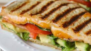 Vegetarian Panini · Grilled mix vegetables and fresh mozzarella. Served with chips and pickles on choice of bread.