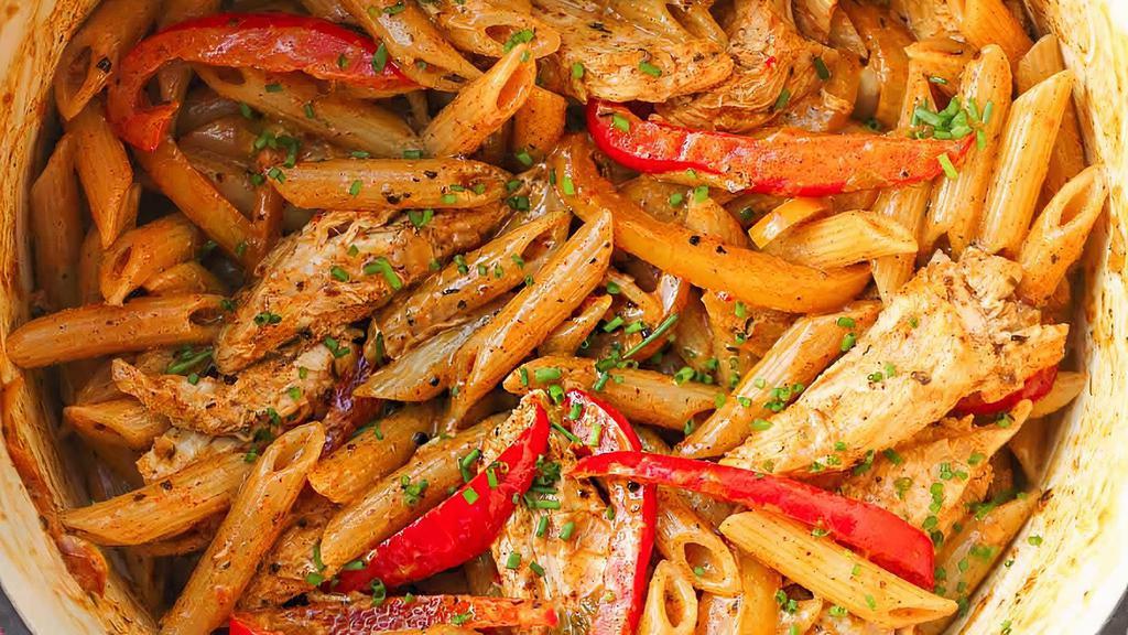 Chicken Rasta Pasta · Creamy penne pasta with sautéed onions, peppers, carrots, garlic, ginger, cilantro, penne pasta.