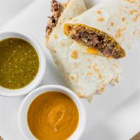 Carne Asada Fiesta Burrito · Grilled sirloin steak topped with sour cream, salsa, cheese, and spanish rice wrapped in a w...