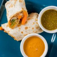 Veggie Valley Burrito · Grilled seasonal vegetables topped with sour cream, salsa, cheese, and spanish rice wrapped ...