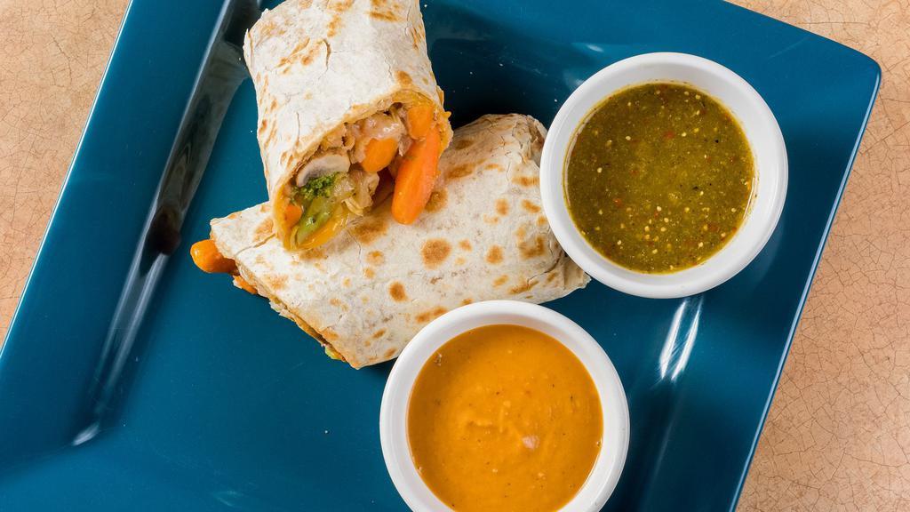Veggie Valley Burrito · Grilled seasonal vegetables topped with sour cream, salsa, cheese, and spanish rice wrapped in a warm tortilla.