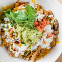 Chorizo Showdown Bowl · Spiced and seasoned ground pork topped with sour cream, salsa, cheese, and spanish rice serv...