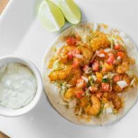 Savory Shrimp Taco · Fresh shrimp topped with sour cream, salsa, and cilantro.