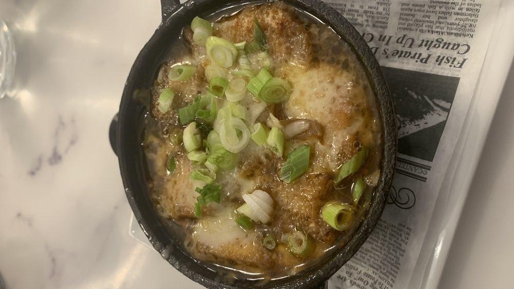 French Onion Soup · Served in an individual crock, topped with gruyere cheese.