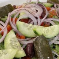 Chopped Greek Salad · Romaine lettuce, cucumbers, red onions, tomato, kalamata olives, grape leaves, green peppers...