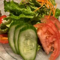 Green Salad · Mixed vegetable, onion ginger citrus dressing.