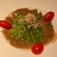 Snow Pea Salad · Boiled snow pea, dried onion and garlic soy dressing.