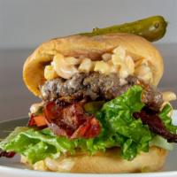 Mac Attack Burger · Toasted bulkie roll. Leaf lettuce, tomato, mac and cheese, apple smoked bacon, boss sauce.