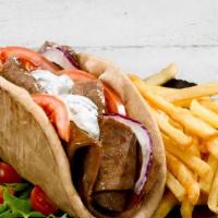Lamb Gyro Combo · Served with French fries and a can of soda.