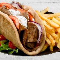 Chicken Gyro Combo · Served with French fries and a can of soda.