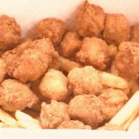 Popcorn Chicken Combo · Served with French fries and a can of soda.
