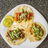 Build Your Own Tacos · Serves 10 people. We provide tortilla, toppings and your choice of protein to create your ow...
