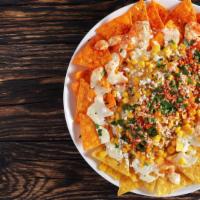 Nacho Platter · Crispy golden tortilla chips topped with hearty beans, pico de gallo, warm creamy cheese, an...