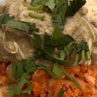 Chicken Taco · Chicken in green mole on a bed of rice