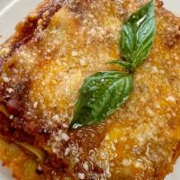 Lasagna Alla Bolognese · Layers of wide flat sheet of pasta, Bechamel sauce, Bolognese sauce (100% prime beef), Parmi...