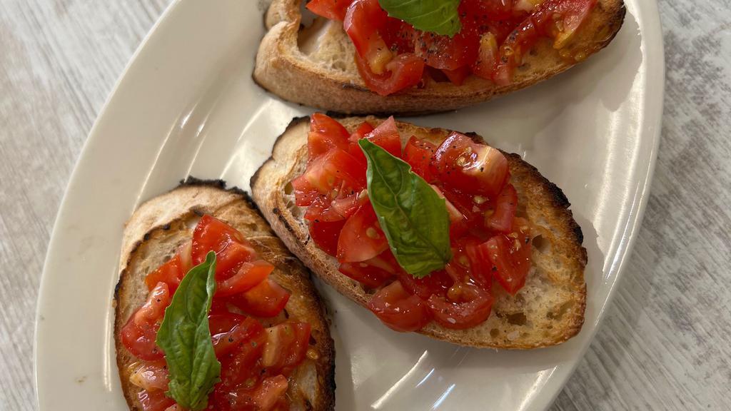 Bruschetta Al Pomodoro · Toasted Homemade Bread with Cherry Tomato, Garlic, Extra Virgin Olive Oil and Basil