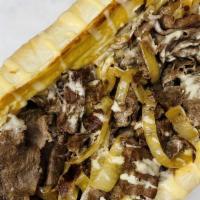 Wizz With Chezstk · Our ribeye shaved steak with fried onions and cheese wiz.