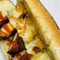 Hot Kchn Chezstk · Chicken tossed in our homemade buffalo aioli, and topped with cheese wiz and our Hot KCHN sa...
