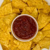 Chips And Salsa · Fresh tortilla chips with a side of salsa.