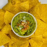 Chips & Guacamole · Fresh tortilla chips with a side of homemade guacamole.