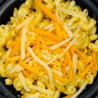 Mac And Cheese · Elbow macaroni in our homemade cheese sauce topped with shredded cheddar cheese.
