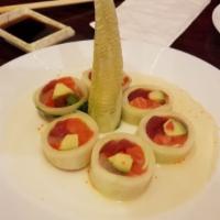 Banzai Tree Roll · Tuna, salmon, white fish, avocado, caviar, wrapped with cucumber on the outside with house s...
