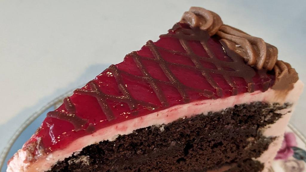 Chocolate Raspberry Mousse Cake · Raspberry mousse and raspberry jam filling.   Finished with a thin layer of raspberry jam.