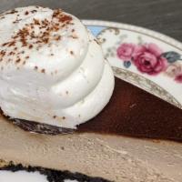 Tiramisu Cheesecake · Photo shows a whole cake.  Each order gets 1 slice only.