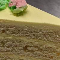 Lemon Key Lime Cake · 4 layer Lemon/lime zest cake with lemon/lime frosting and rose buds.