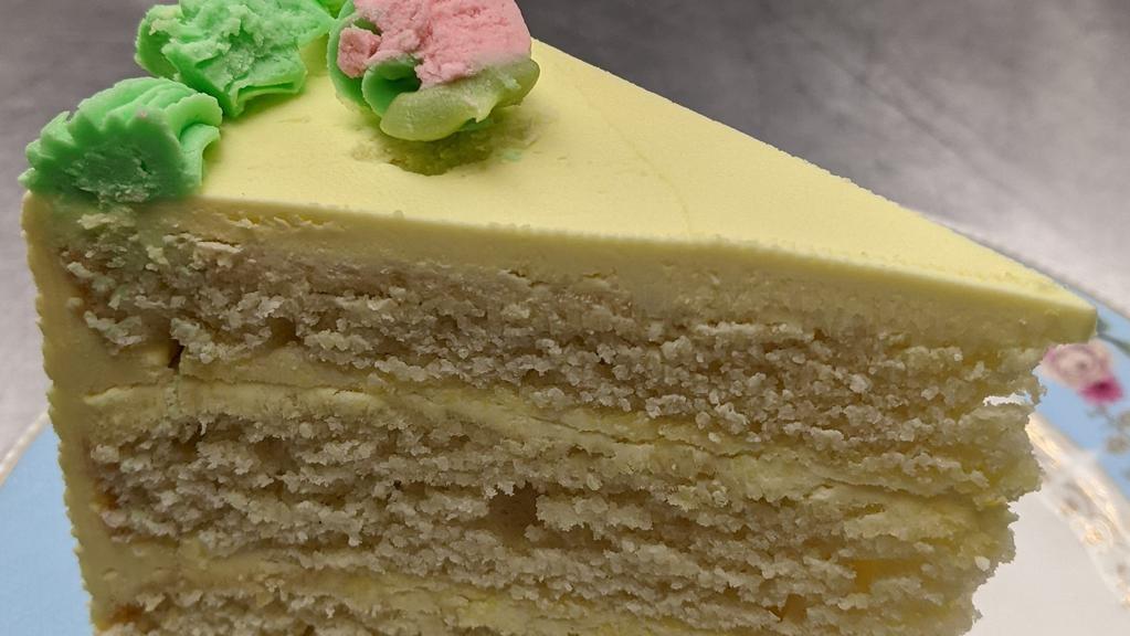 Lemon Key Lime Cake · 4 layer Lemon/lime zest cake with lemon/lime frosting and rose buds.