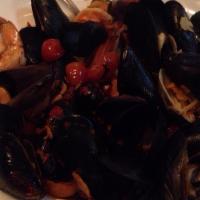 Zuppa Di Pesce Dinner · Shrimp, scallops, mussels, clams, and lump crab sautéed with garlic, basil, and light tomato.