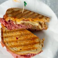 Corned Beef Reuben · Hot corned beef, swiss, sauerkraut, and russian dressing on rye.