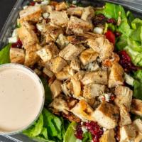 Chopped Blue Cheese Salad · Romaine mix, grape tomatoes, blue cheese crumbles, sweet dried cranberries, candied pecans, ...