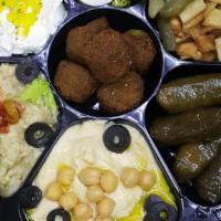 Mixed Appetizer Plate · Hummus, baba ghanouj, labaneh (three), falafel (two), kibbe (three), grape leaves.