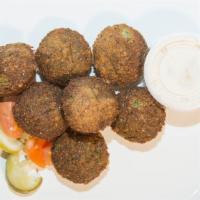 Falafel (7 Pcs) · Vegetarian. Deep fried balls made from ground chick peas.