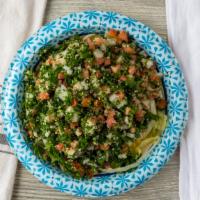 Tabouli · Vegetarian salad of finely chopped parsley, tomatoes, onion, bulgur, with a light drizzle of...