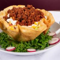 Taco Shell Salad · Grilled chicken or ground beef, lettuce, tomato, beans, olives, corn, monterey jack cheese, ...