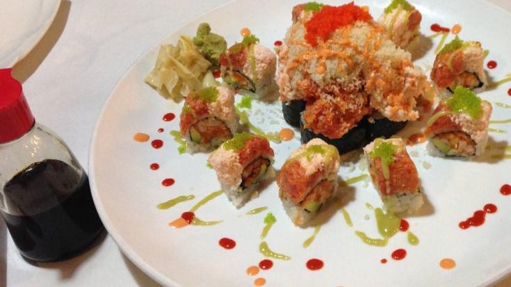 Volcano Roll · Cali roll inside/snow crab/spicy tuna on top crunchy/spicy sauce/scallion/masago.