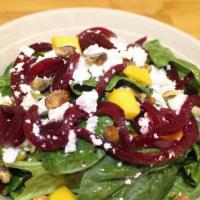 Spinach Salad · Contains nuts. Spinach, mango, pistachios, golden beets, Vegan cheddar, balsamic vinaigrette.