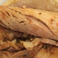 Arepa Cubana · Oven Roasted Pork, Cooked Ham over swiss cheese pressed with Pickles and mustard inside of a...