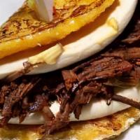 Ropa Vieja & Cheese Cachapa · Cornmeal pancakes folded in half with Ropa Vieja & Tropical Cheese