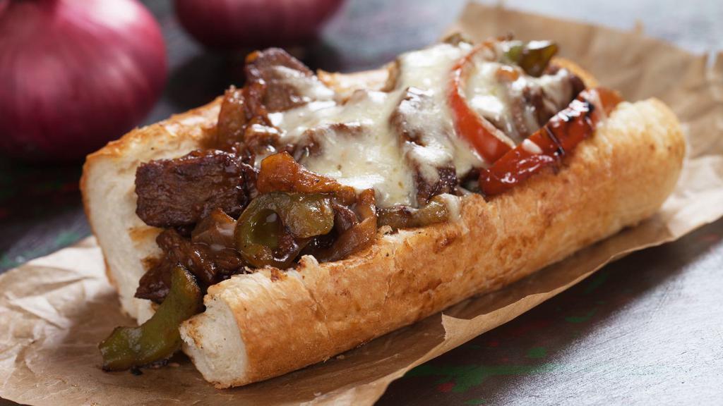 Texas Philly · Thinly sliced steak with onions, peppers, 880 sauce and mozzarella cheese stuffed in between fresh-baked bread.