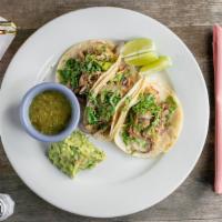 Tacos Maya · Three soft shelled corn tortillas stuffed with pulled pork, sauteed onions, tomatoes cilantr...