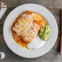 Chimichangas · Crispy rolled flour tortillas with chicken or beef, Muenster cheese topped with mild sauce, ...
