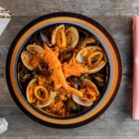 Paella Mariscada · Seafood paella with shrimp, scallops, clams, mussels, red snapper, chorizo español, calamari...
