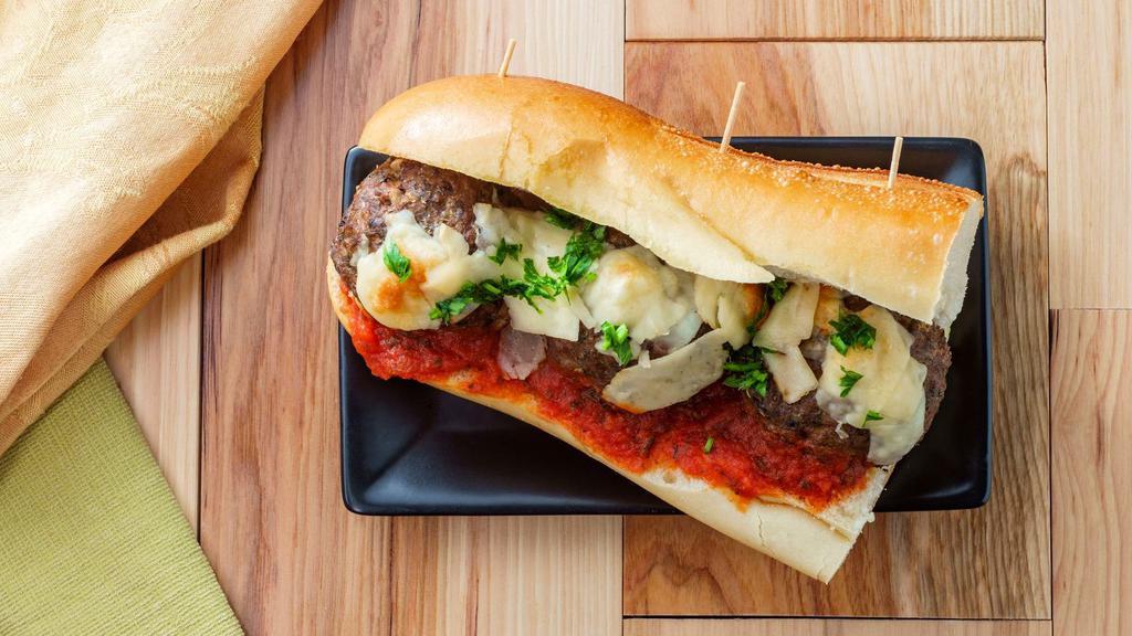Meatball Parmigiana · Juicy house-made beef meatballs topped with our rich marinara sauce and melted mozzarella.