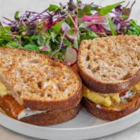 Best Breakfast Sandwich In The Lower East Side · Our house-made sourdough bread toasted, scrambled egg, cheddar cheese, roasted tomato, and g...